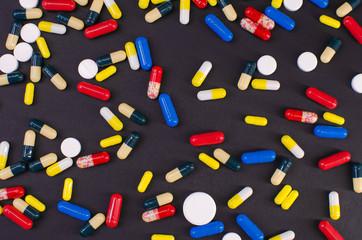 tablets scattered all over the background of black