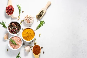 Zelfklevend Fotobehang Set of fresh organic aromatic spices and herb on white marble table with copy space for your text.  © Iryna