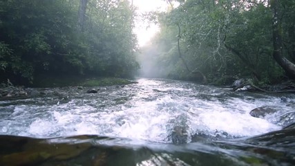 A man fishing in the outdoors of Fires Creek, North Carolina. A calm, brisk day to be fishing in the stream. - Powered by Adobe