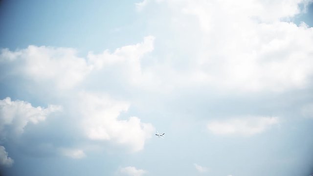 Big passenger plane in the blue sky. Takeoff. A general plan. Aerobatic figures. Airshow. 28 seconds