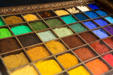 A picture of a colored sand inside the boxes. Many shades of different colors. The color is natural.