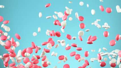 Freeze motion of flying pills on white background