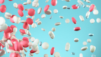 Freeze motion of flying pills on white background