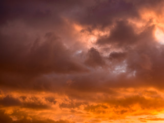 A dramatically lit winter cloudy sky at sunset