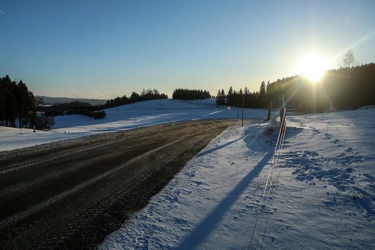 The picture illustrates the winter conditions on roads, when the ice, snow and frost is on the tarmac. 