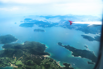 Naklejka na ściany i meble Aerial view of Hong Kong green islands from a flying airplane