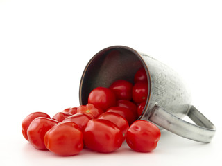 Ripe, red cherry tomatoes of the confetto variety.Isolate.White background