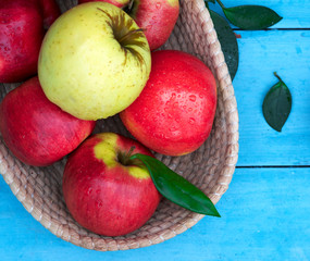 .apples in a basket on a blue background