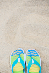Fototapeta na wymiar blue-green slates on a background of sand