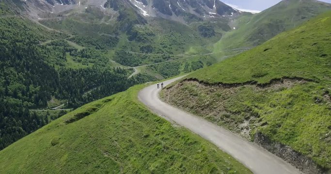 incredible drone aerial view of two road cyclists