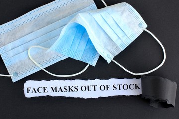 Announcement with Text face masks out of stock on black background with respiratory protective medical masks