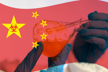 A chemist stirs a substance in a flask against the background of the Chinese flag and biohazard...