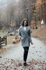 Teen girl smiling with perfect smile in a park and looking at camera