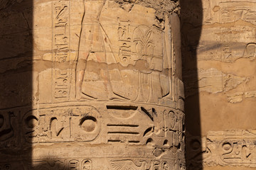 Karnak Temple, complex of Amun-Re. Embossed hieroglyphics on columns. Great Hypostyle Hall. Luxor...