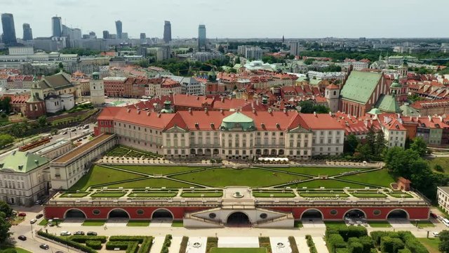 Historic centre of Warsaw, Poland. Summer 2019.  Aerial footage of the royal castle in Warsaw from its gardens towards the historic city square.