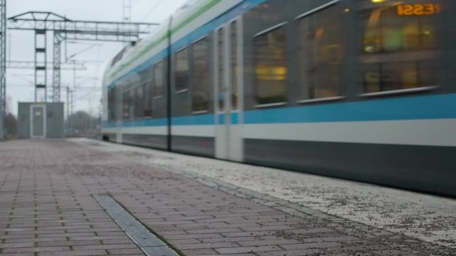 Train arrives on empty station. Railways transportation.