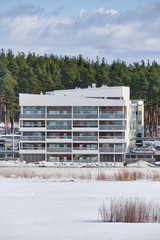 Fototapeta na wymiar The brand new apartment building on sunny day in Joensuu, Finland.
