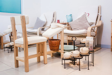 SPA Place for relaxation, treatments on White spa massage bed with candles, massage oil