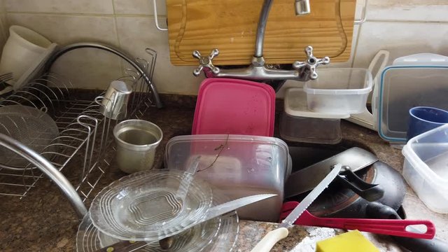 Kitchen utensils need a wash, pan scene.