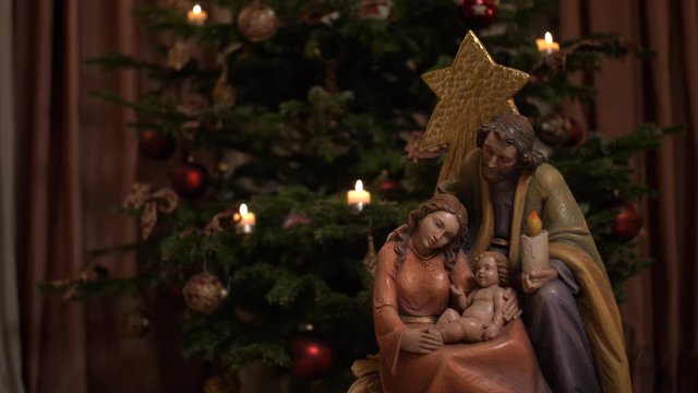 Statue figure of jesus christ and maria and josef slow movement on a slider