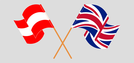 Crossed and waving flags of Austria and the UK