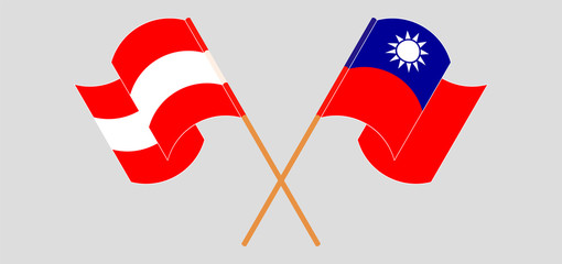 Crossed and waving flags of Austria and Taiwan