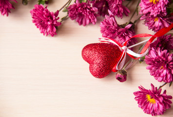 Valentines day background. Red Heart and pink flowers on wooden background,copy space. Greeting card template. Concept of Happy Valentine day. Mothers day, 8 March card. Flowers background.