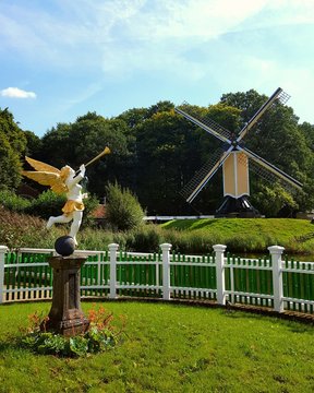 old wooden windmill in the garden