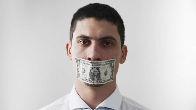 The guy with the taped mouth money raises sad eyes. Paid for silence. Bribes and corruption. On a white background