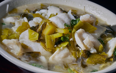 A bowl of fish and pickled vegetable noodle soup. Chinese cuisine served in State College, Pennsylvania, USA