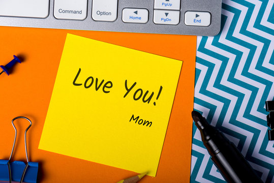I love you. Your Mom - color message on workplace from mother. Valentine and mother day greating card