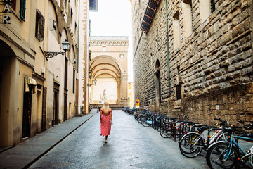 Woman walking at old town in Florence.