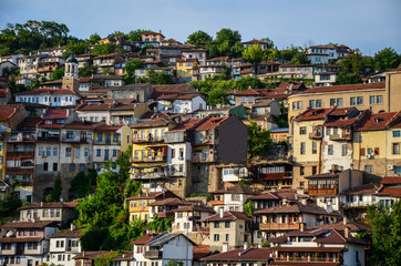 Fototapeta na wymiar Cityscape of Bulgarian old town Veliko Tarnovo houses with tradiotional architecture