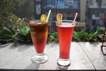 glass of juice on wooden table