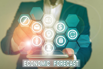 Conceptual hand writing showing Economic Forecast. Concept meaning attempting to predict the future...