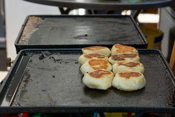 Delicious fried bread on a grill plate.