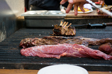 Delicious piece of meat, striploin on a charcoal barbeque.
