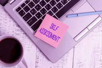 Writing note showing Self Assessment. Business concept for evaluation of oneself or one actions and...
