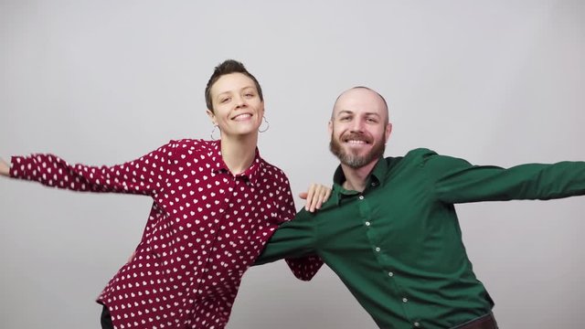 Swing dancers on white background. Man and woman are dancing lindy hop or boogie woogie dance. Happy couple dancing.