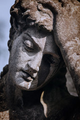 Sad eyes of beautiful angel. Fragment of ancient statue. Death, pain and end of life concept.