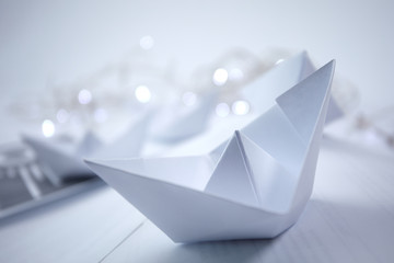 paper boats on the documents