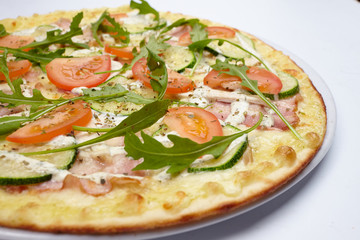tasty pizza with tomatoes and zucchini
