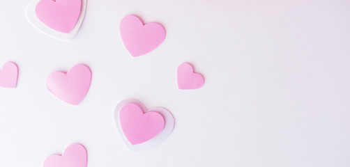 Fototapeta na wymiar Pink valentine hearts on white background with copy space.