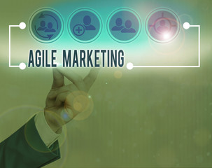 Writing note showing Agile Marketing. Business concept for focusing team efforts that deliver value...