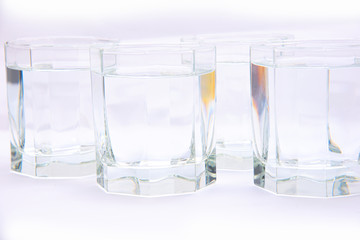 glass glasses filled with water isolated on a white background