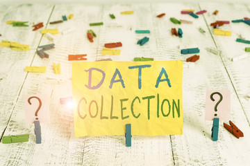 Conceptual hand writing showing Data Collection. Concept meaning gathering and measuring information on targeted variables Crumbling sheet with paper clips placed on the wooden table