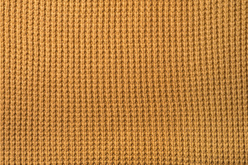 mustard knitted texture, background knitted mustard color