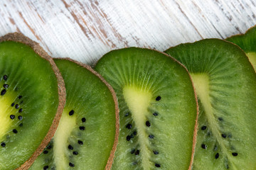 Green sweet tropical kiwi. Slices of juicy kiwi. Close-up.