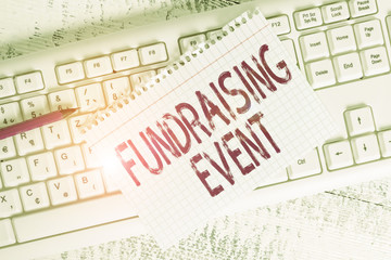 Writing note showing Fundraising Event. Business concept for campaign whose purpose is to raise...