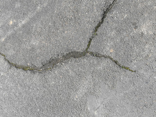 Obraz premium Texture of cracked macadam asphalt for design, background or wallpaper.